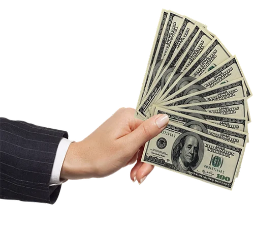 A hand holding 12 $100 bills